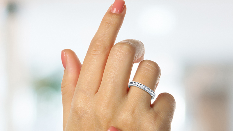 How to Find Affordable Marriage Rings? 3 woman wearing a diamond eternity band on her ring finger