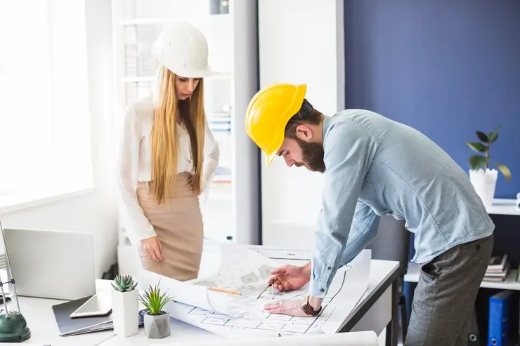 What is the Standard Takeoff Procedure in Construction? 2 male female engineer working plan office 23 2147842978