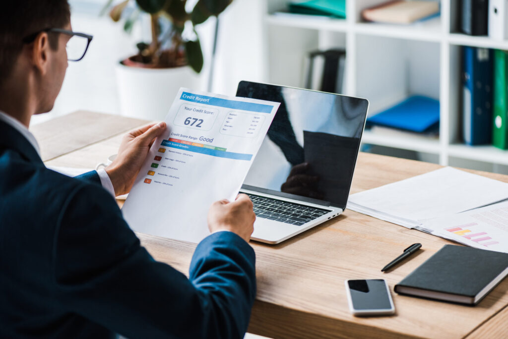 Get Accurate Financial Documents Fast with Our Professional Bank Statement Generator Service 2 cropped view of man holding paper with credit repo 2022 12 16 20 23 26 utc 2 scaled 1